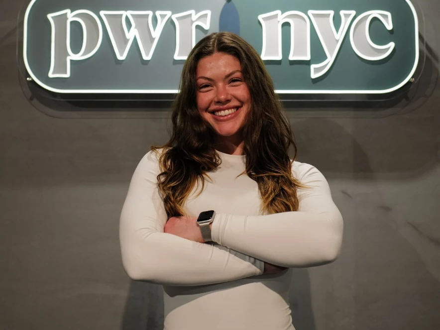 Gracie Magill, Resident Trainer at PWR NYC, coaching inside the Upper West Side studio